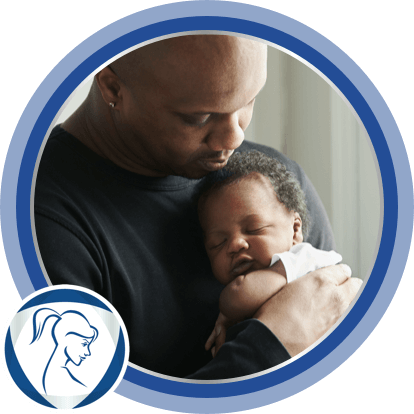 Father carrying baby after applying Bepanthen moisturizing cream